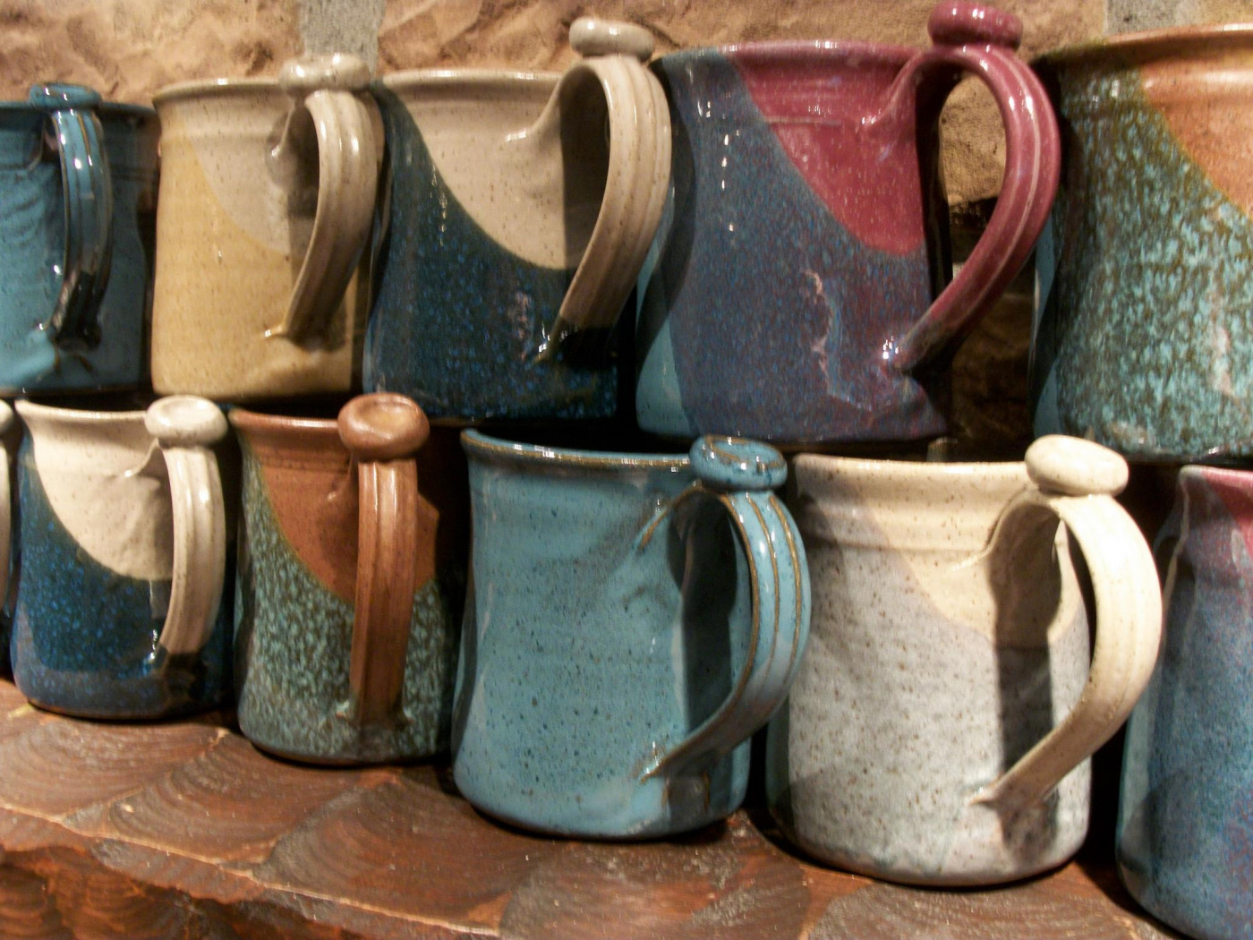 A line of mugs from the Greg Rudd Pottery Studio