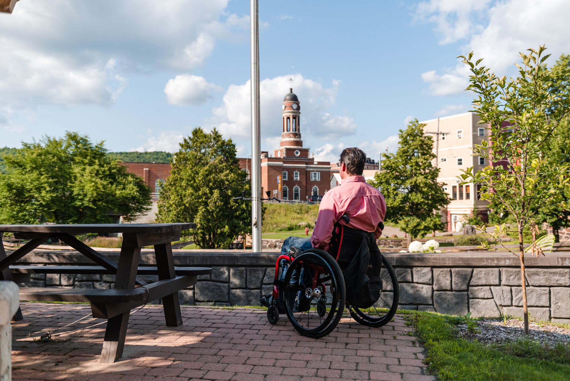 A wheelchair user in a Saranac Lake park