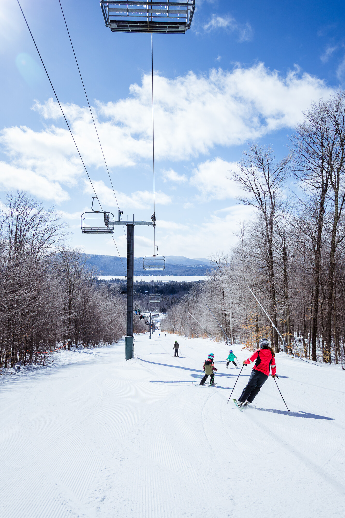 Skiers heading down Oak Mountain