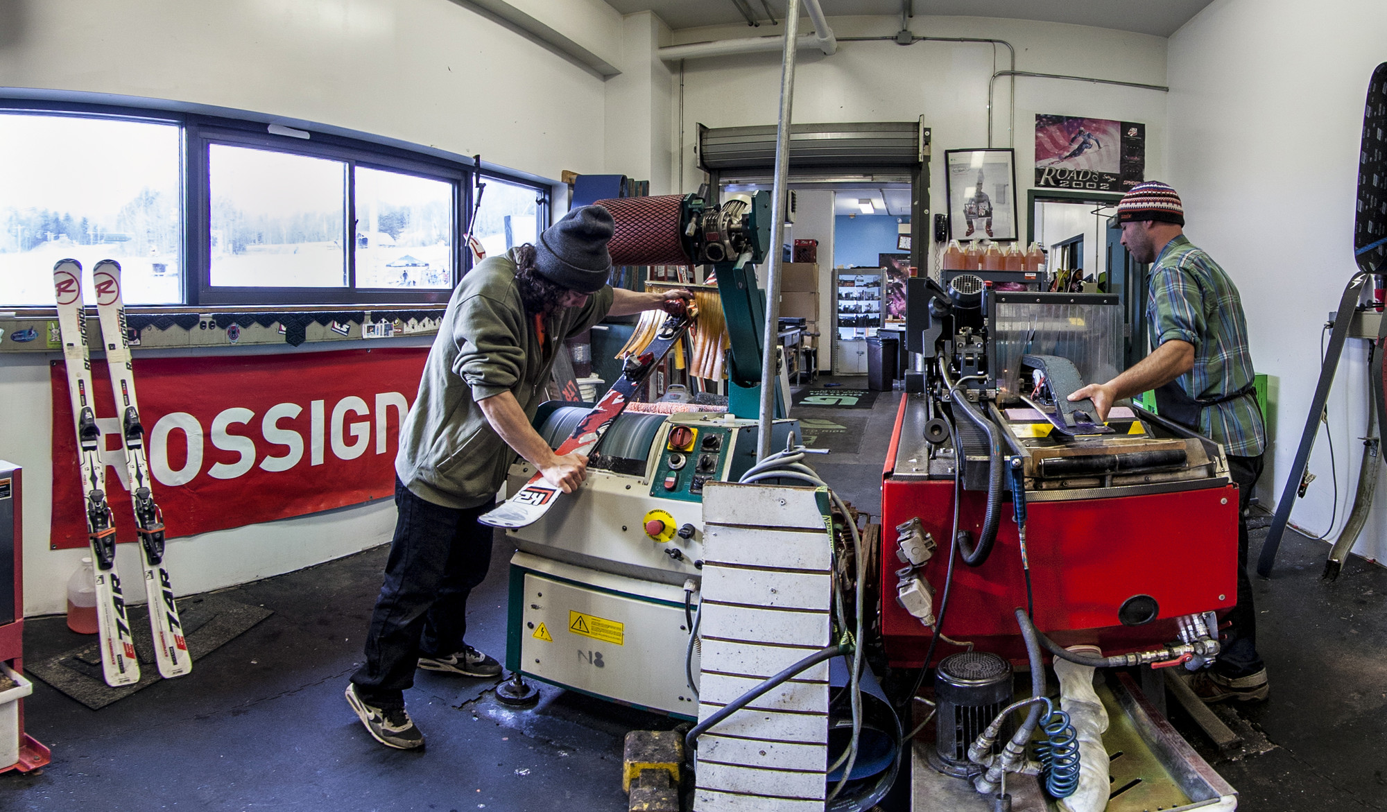 Someone working on skis in a ski shop