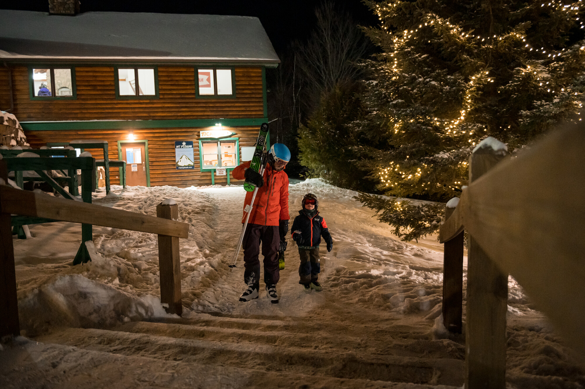 A father and son about to night ski at Mount Pisgah