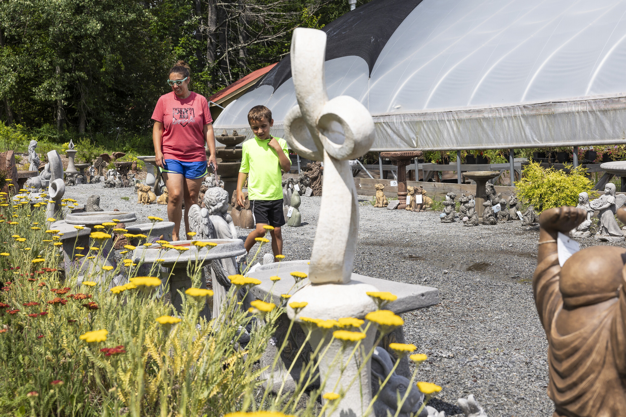 A mother and son walking at a farm