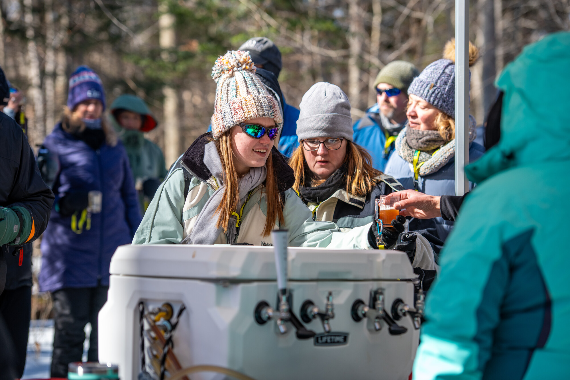 Someone getting a glass filled with beer at the Tupper Lake Brewski