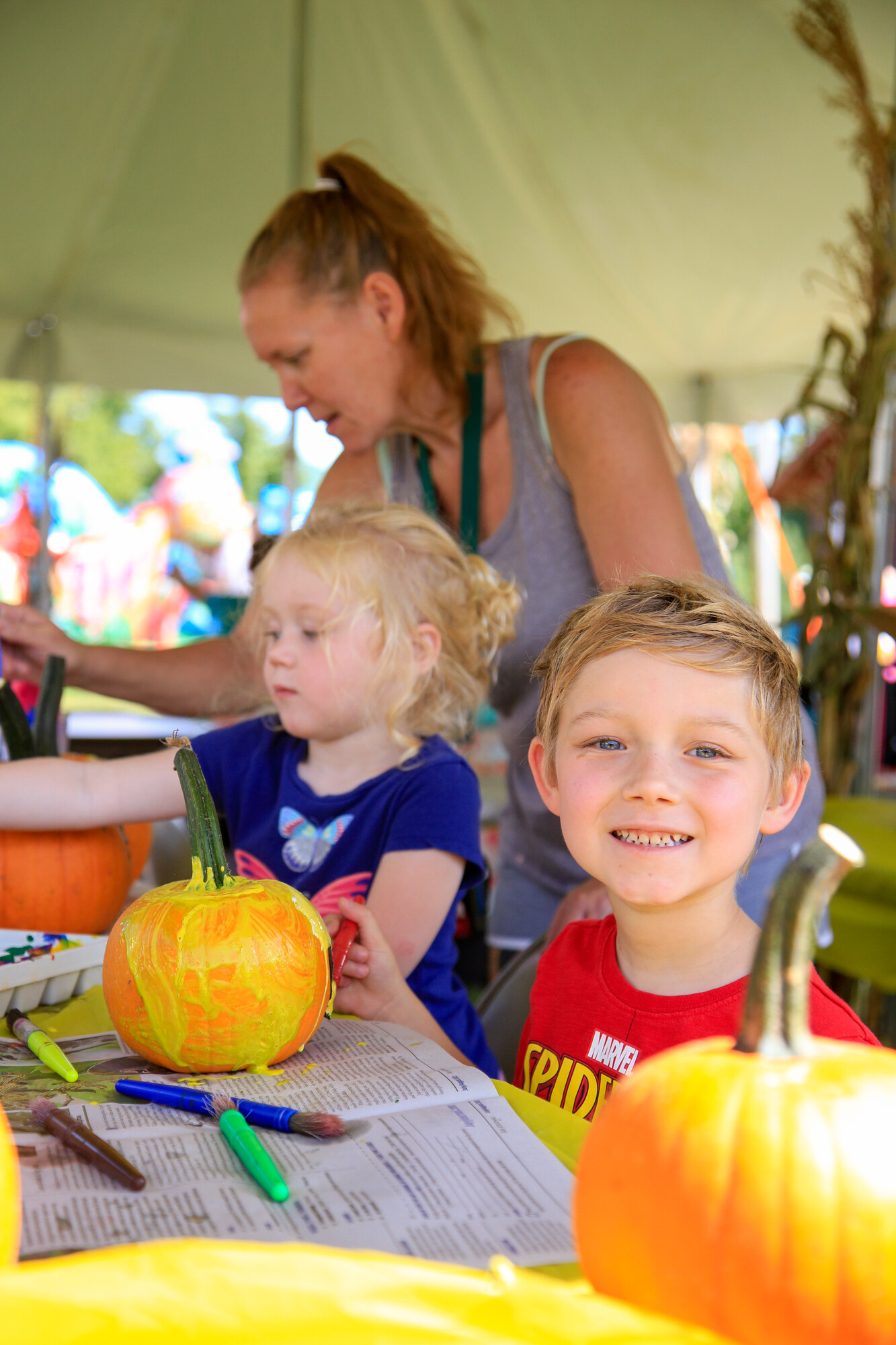 Kids painting pumpkins