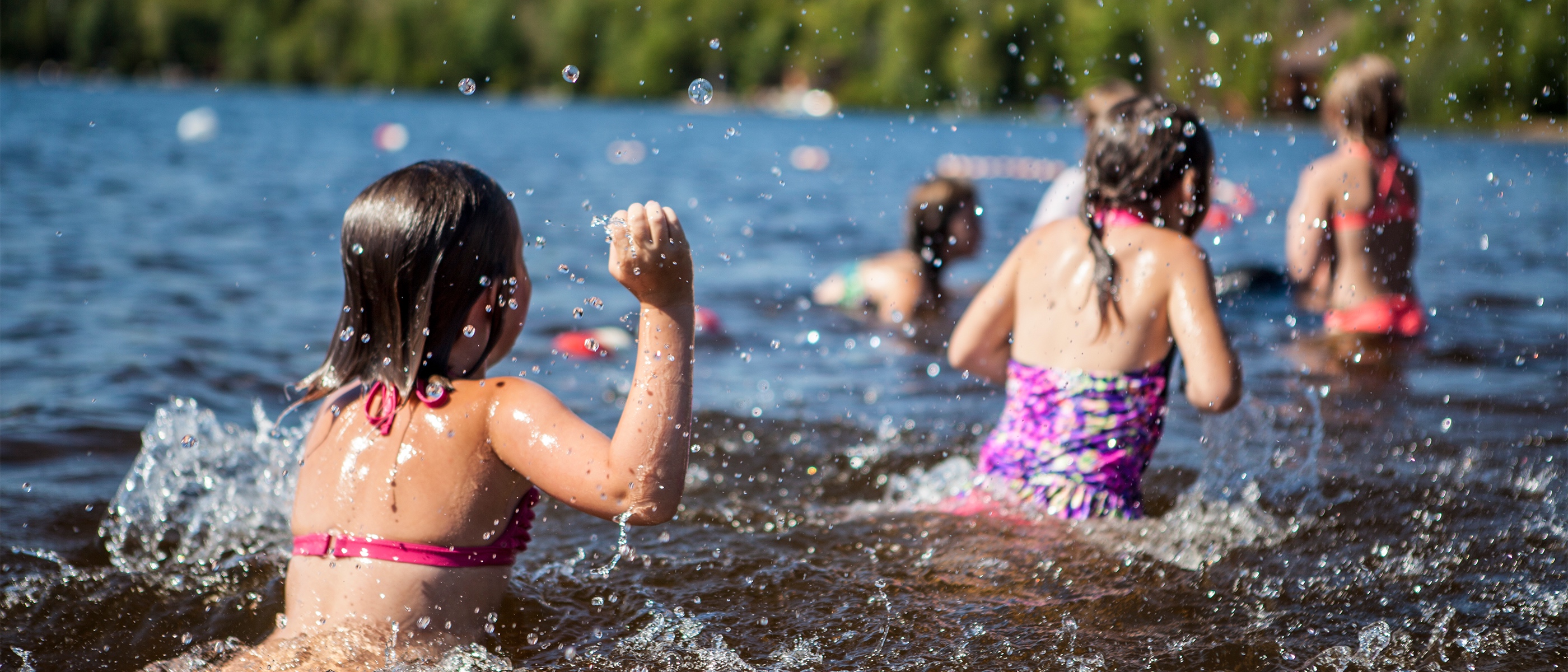 Kids swimming at a beach