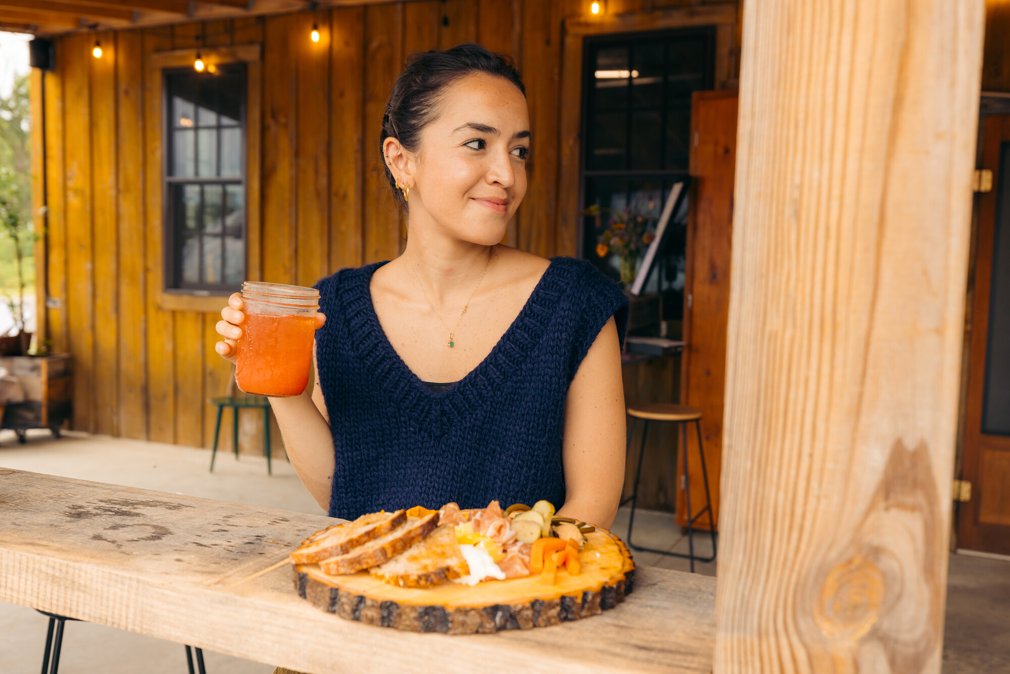 A woman eating food on a patio