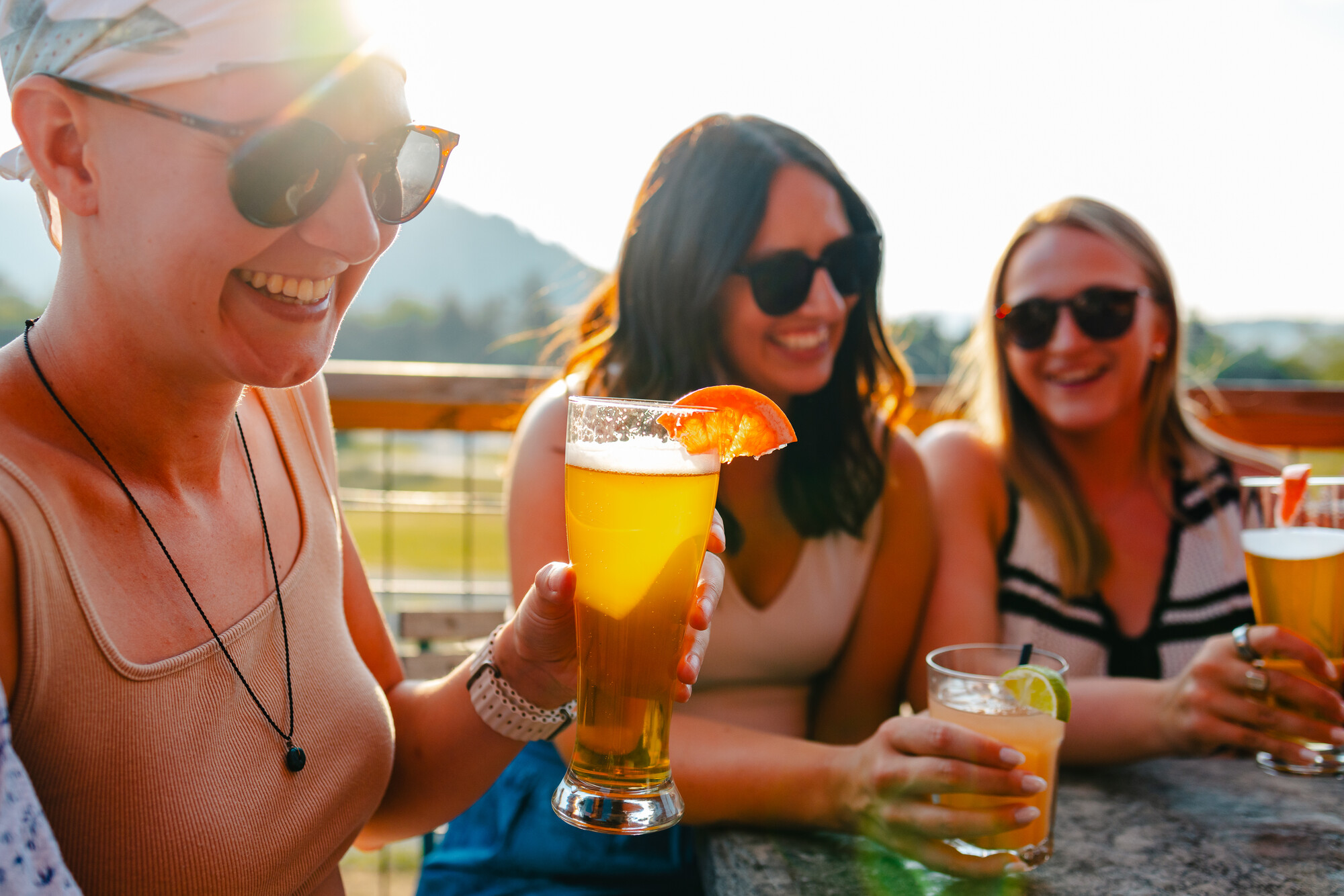 Three women having a beer