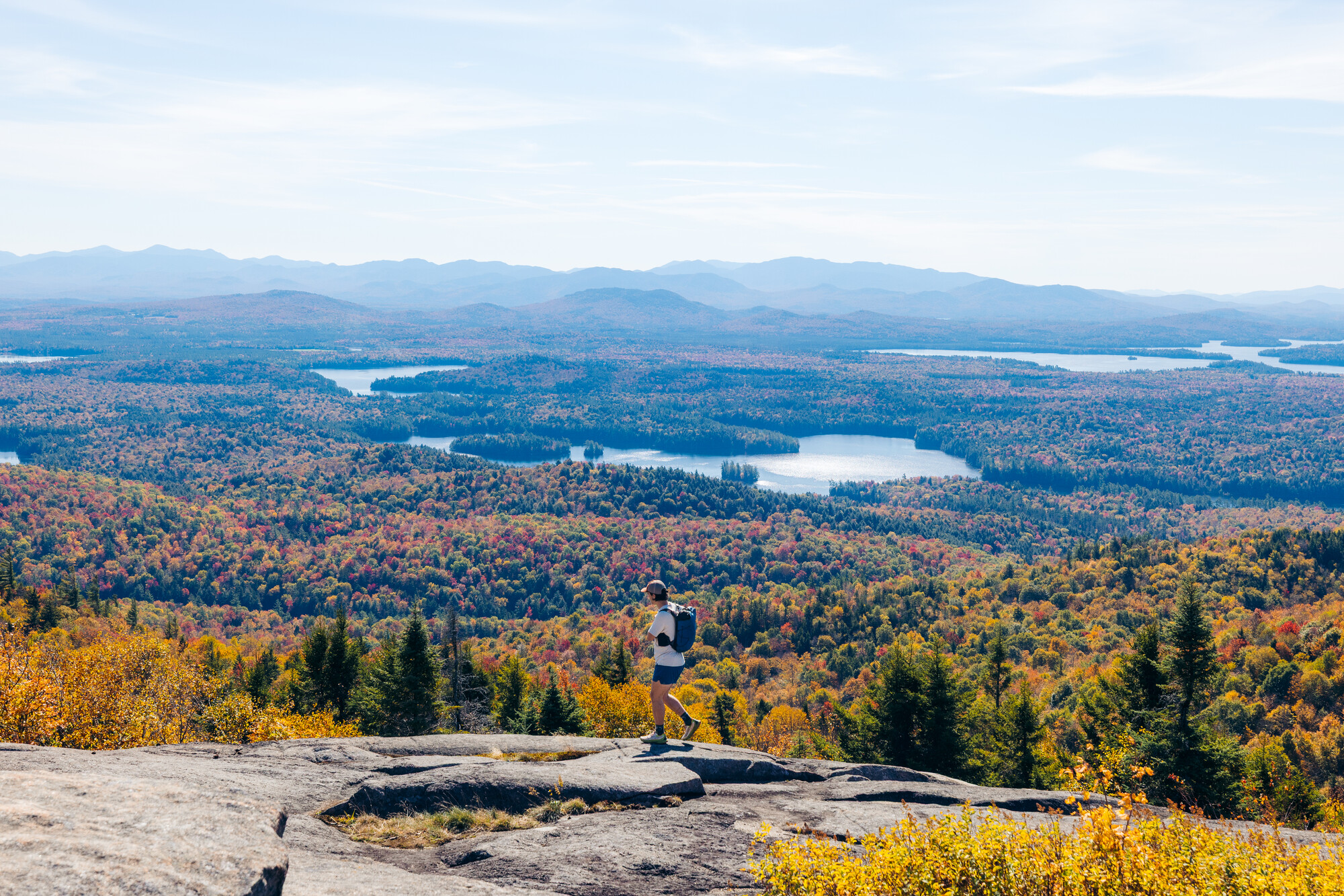 A solo hiker on a fall summit