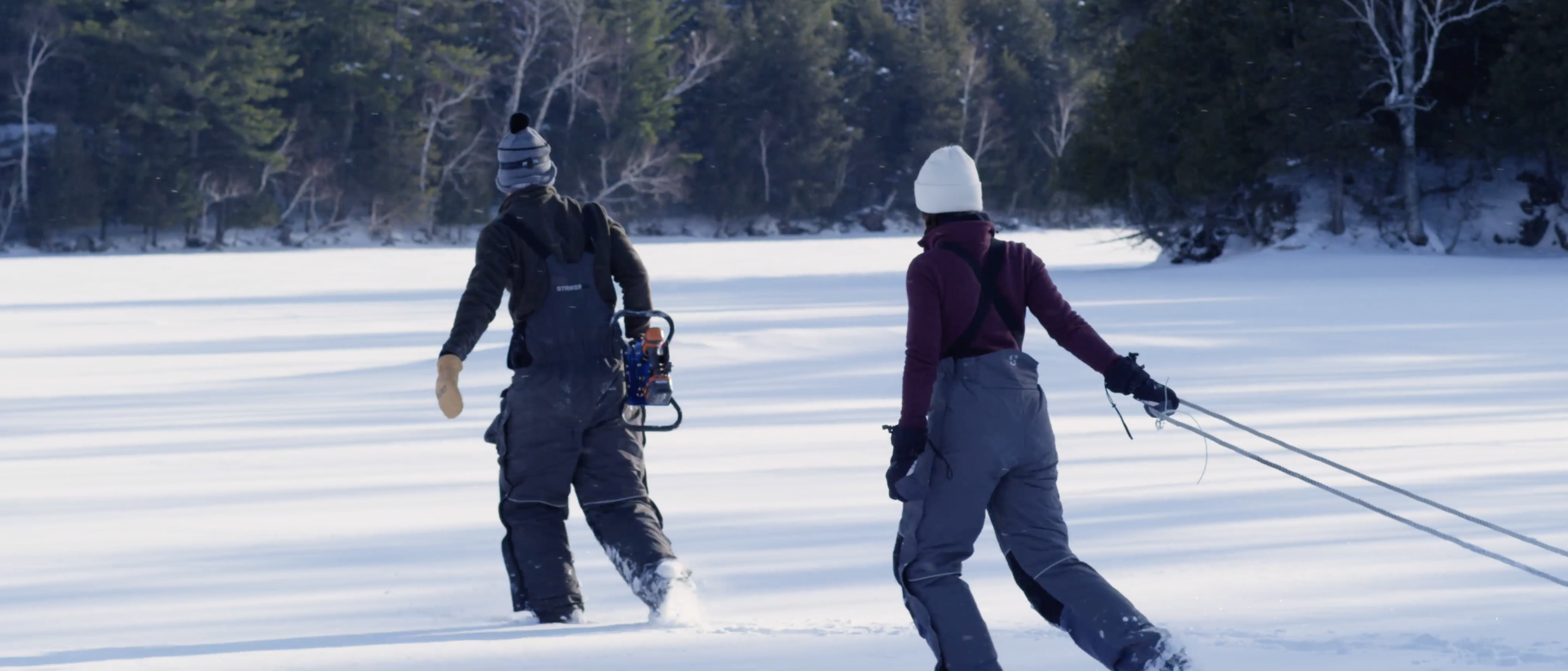 Two people ice fishing