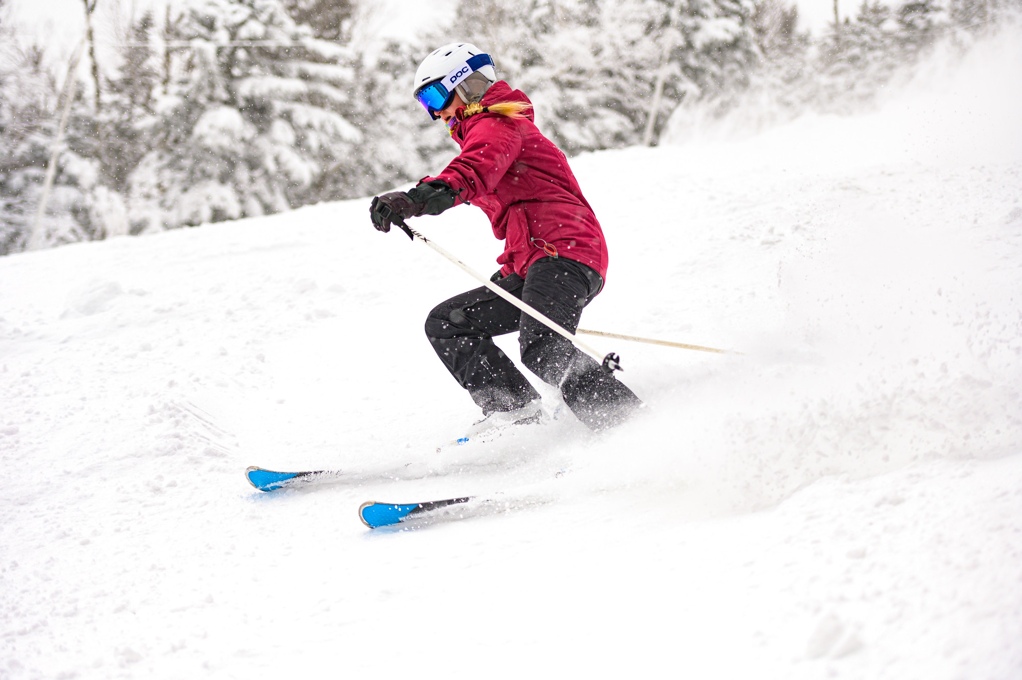 A woman skiing in the snow.