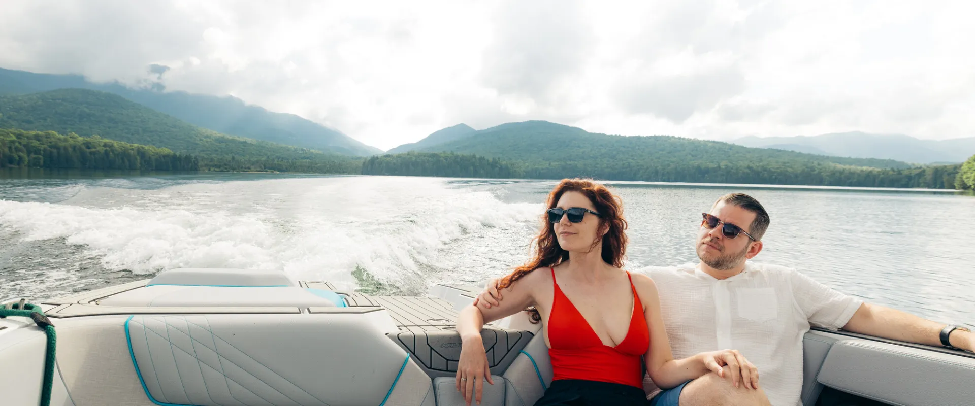 Two people on a boat in Lake Placid