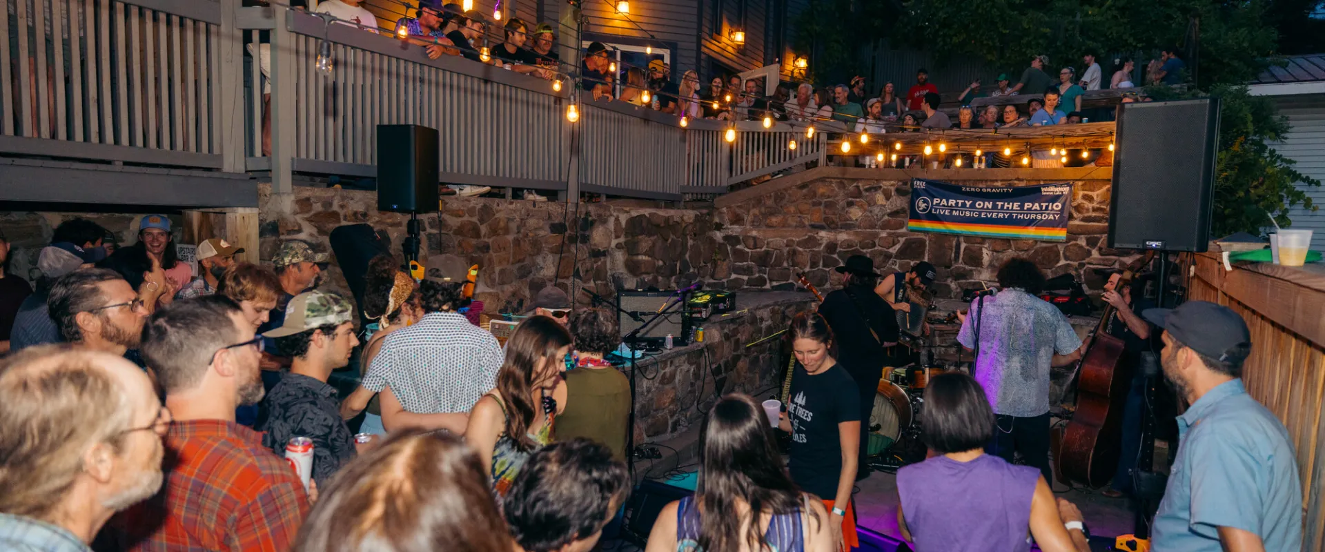People dancing at a live music outdoor event