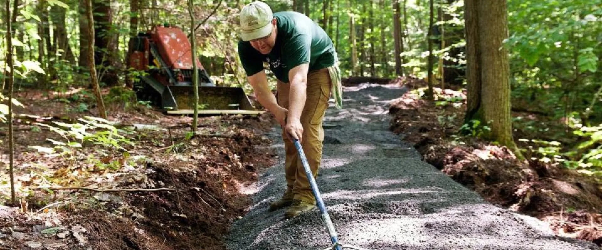 A trail builder making an accessible trail