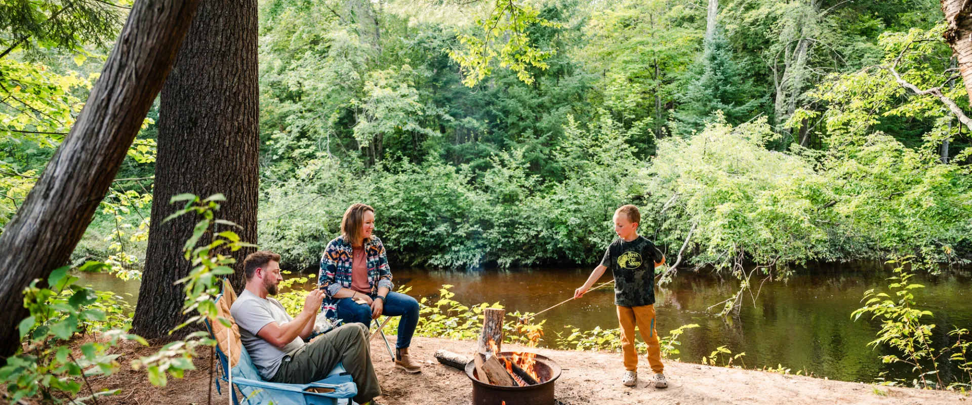 A family roasted marshmallows at a fire pit