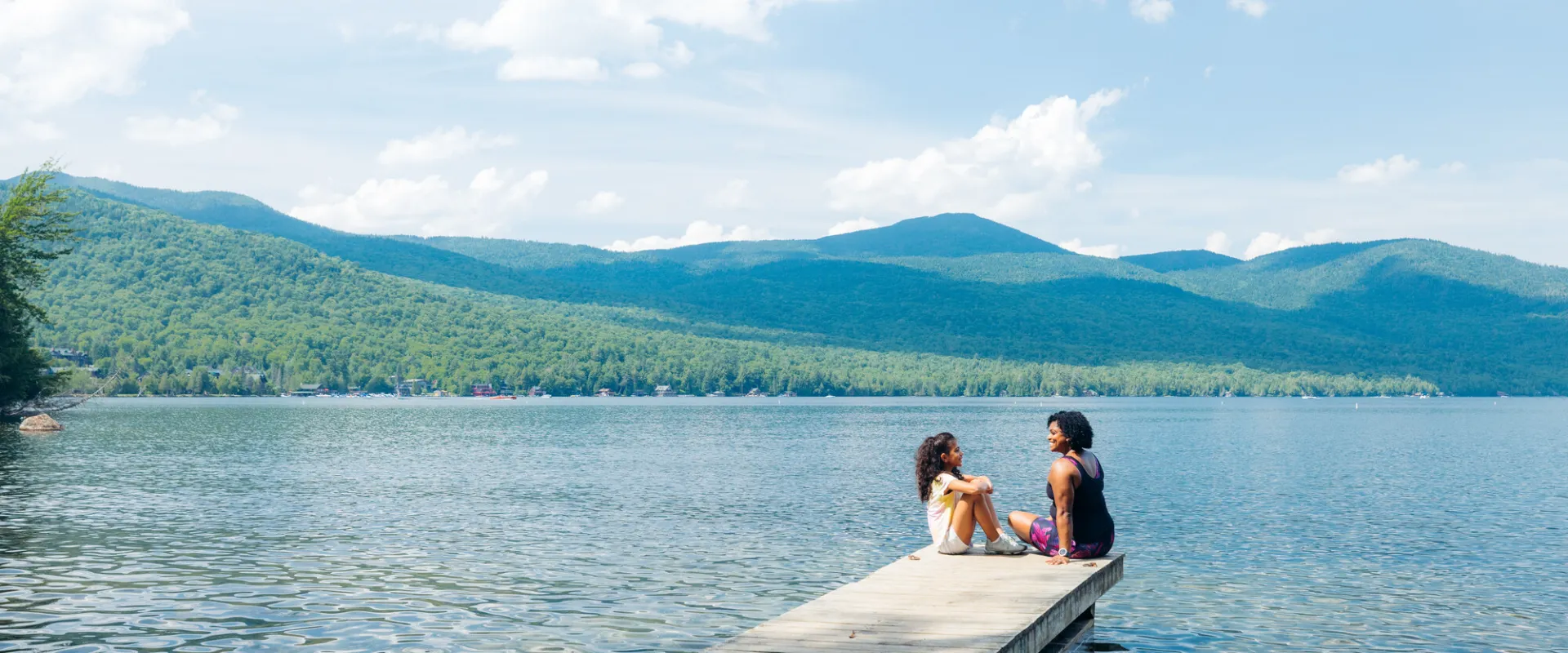 A mom and daughter on a boat dock