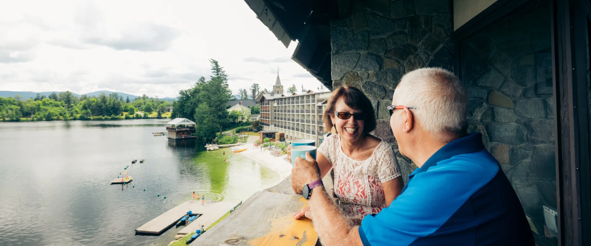 A couple having coffee on a scenic balcony