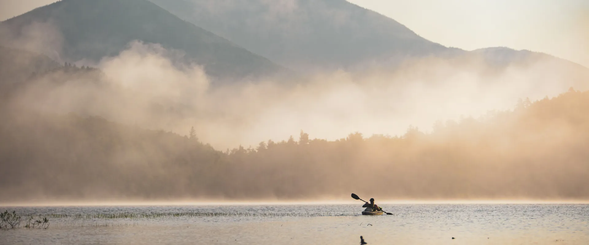 A kayaker in the mist