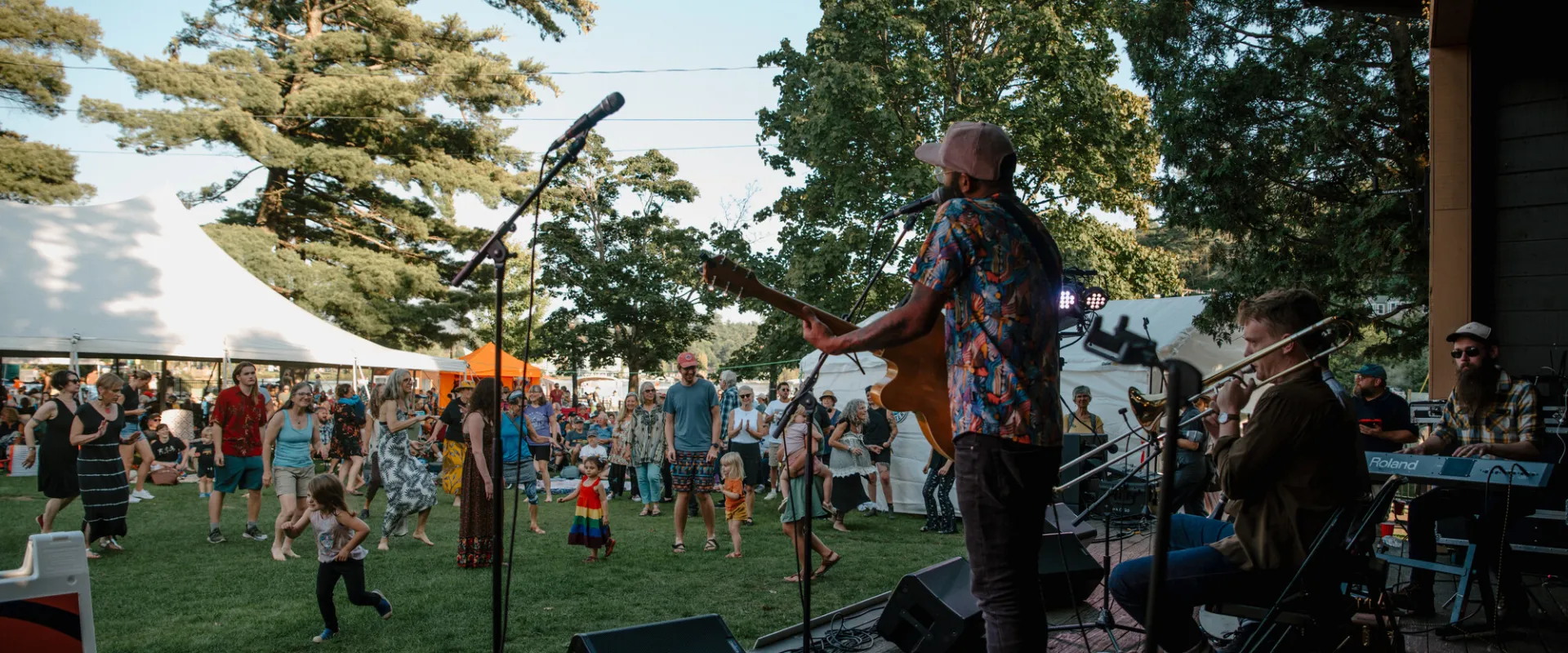 An outdoor concert by Lake Flower