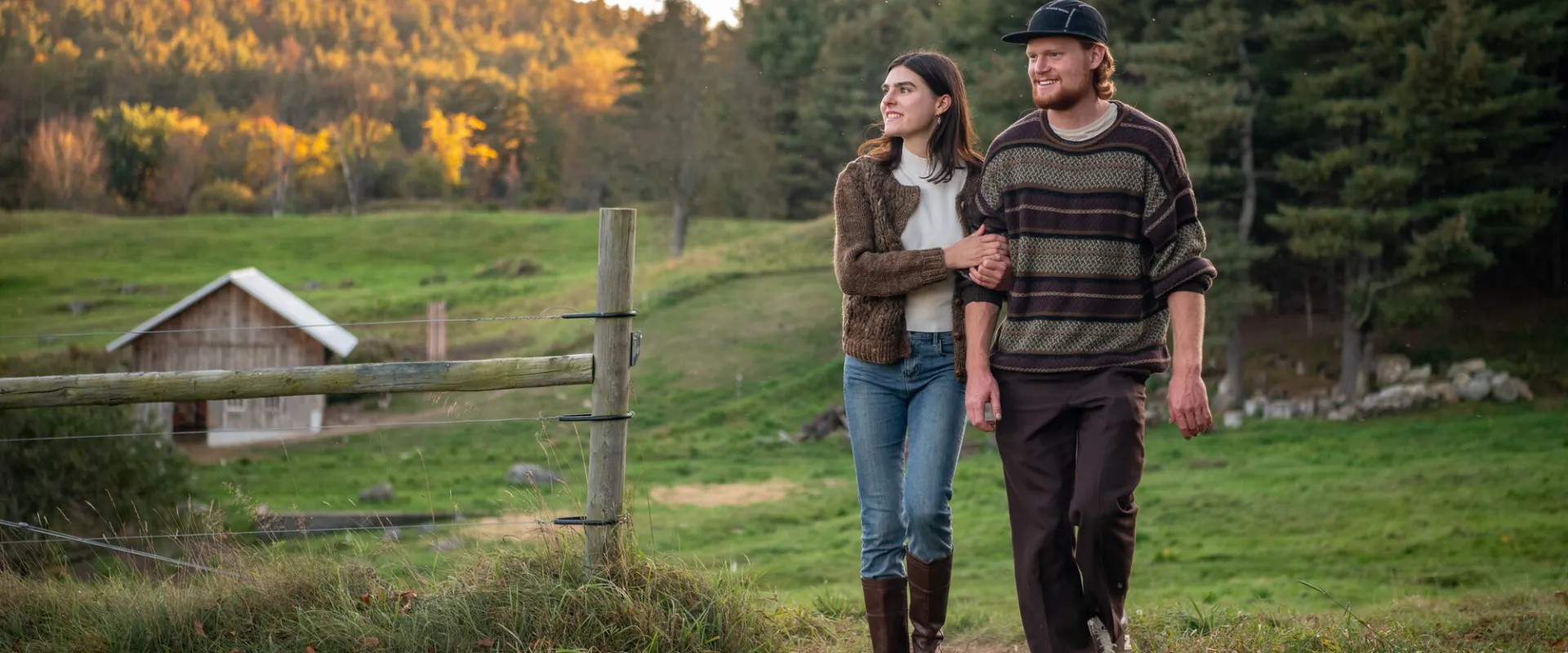 A couple at a farm in the fall.