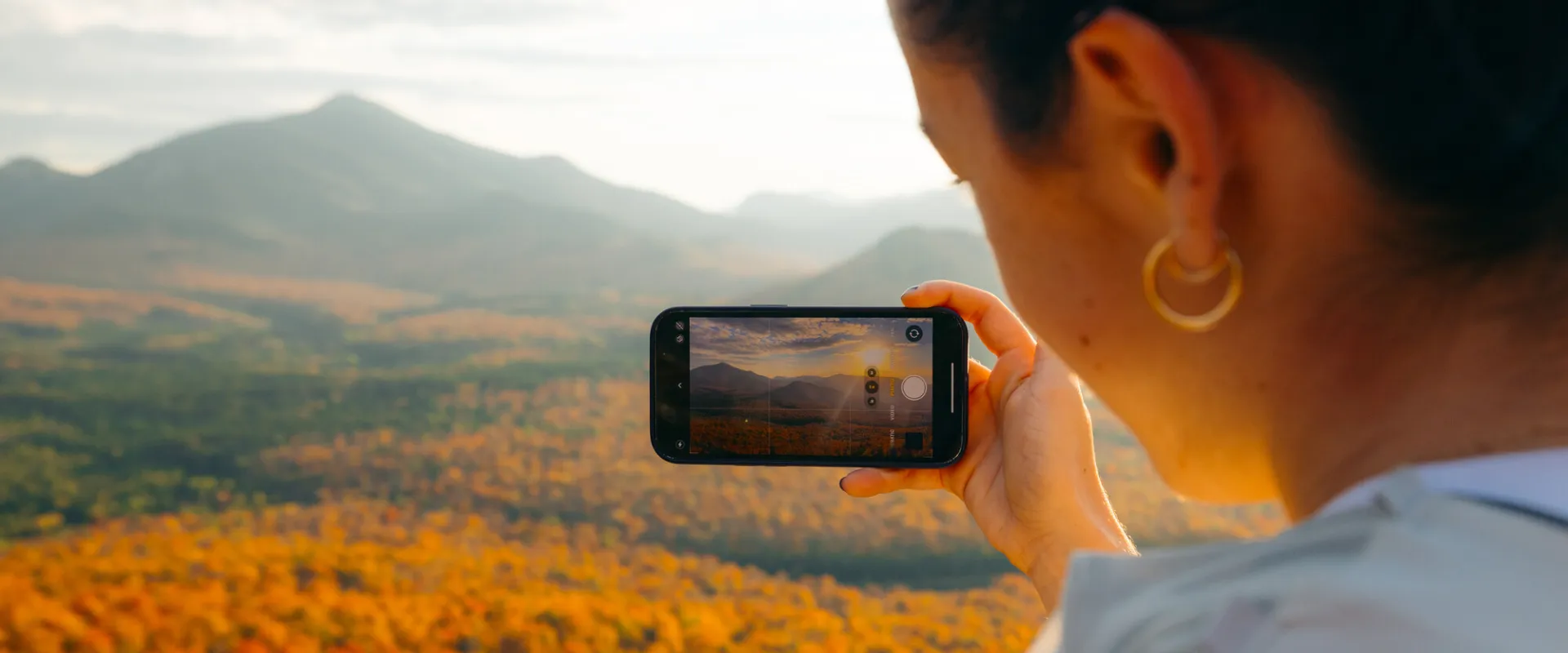 Taking a fall photo on a summit.