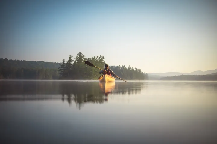 A paddler on Forked Lake