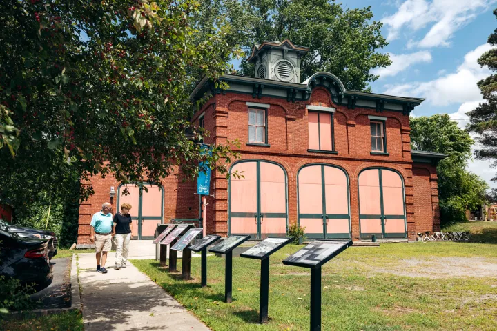 An older couple walking a historic site