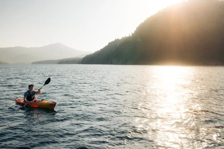 A paddler in Lake Placid