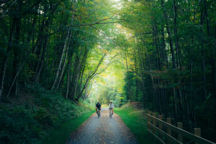 Two people biking on the Rail Trail