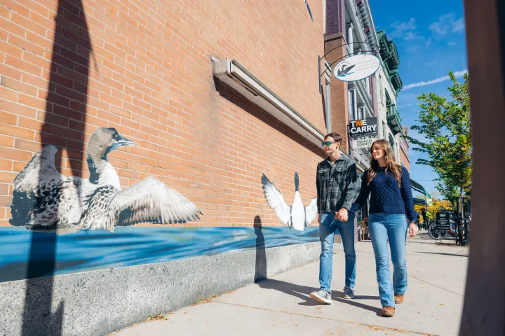 A couple walking on Main Street