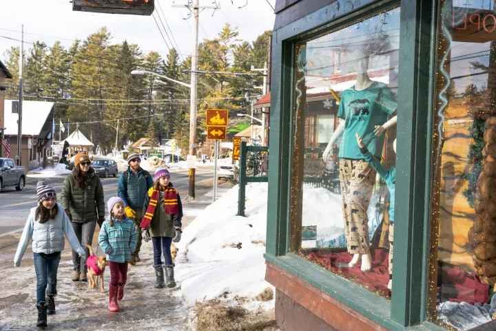 A family going shopping in the winter