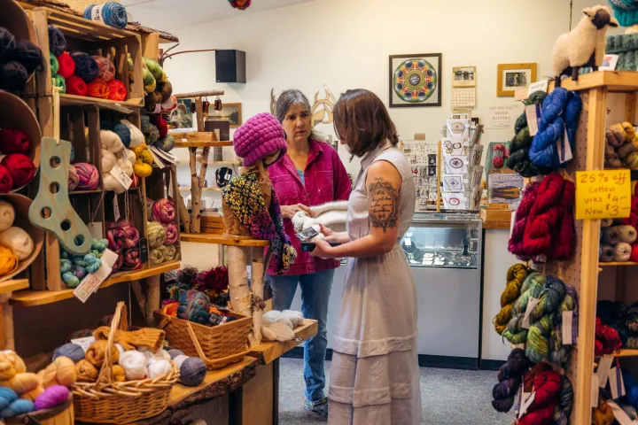 A woman looking at wool products