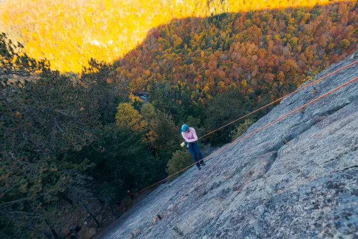 A climber being lowered off a route