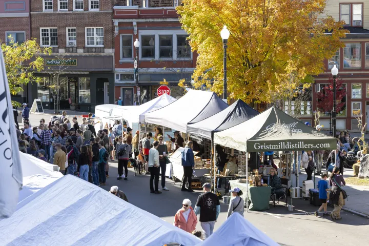 Tents set up at a farmers' market in the fall