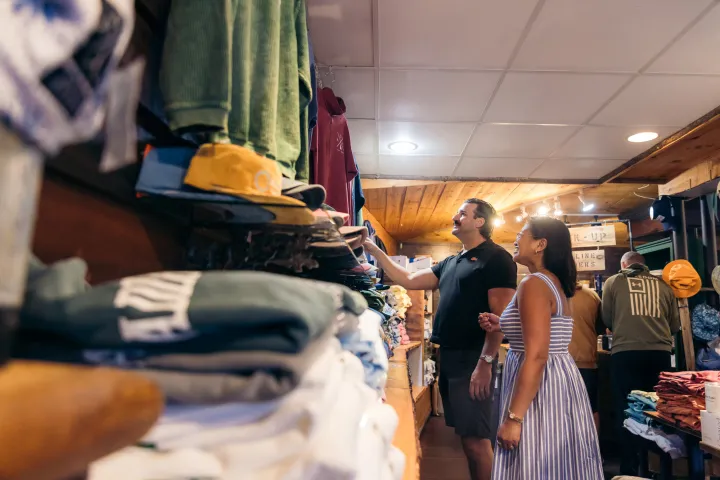 A couple shopping at an Adirondack apparel store