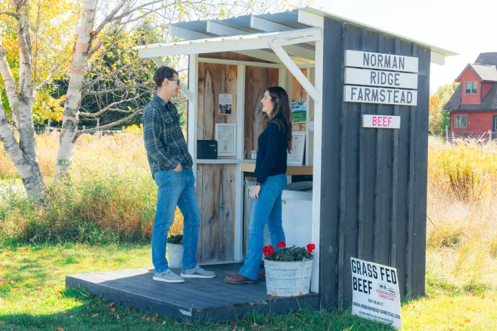 A couple at a small farmstand