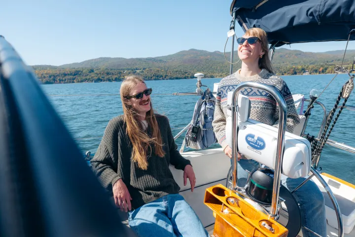 A couple on a sail boat in Lake Champlain