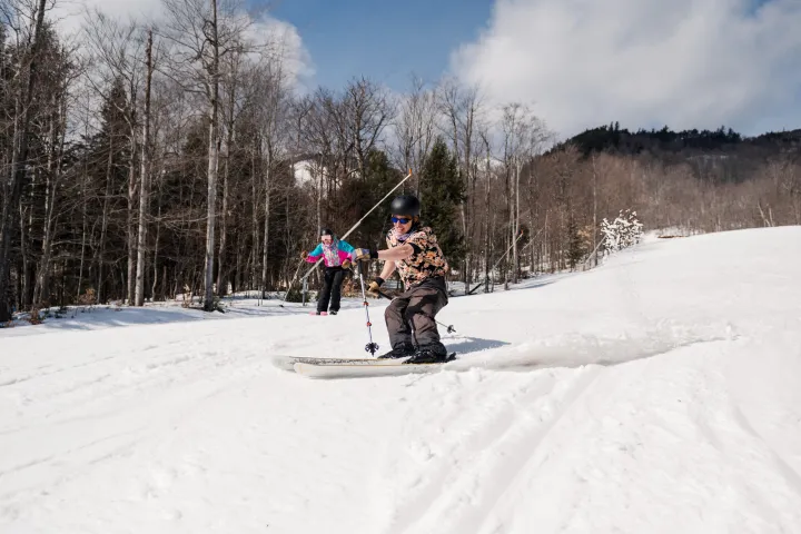 Two skiers on Whiteface Mountain in the spring