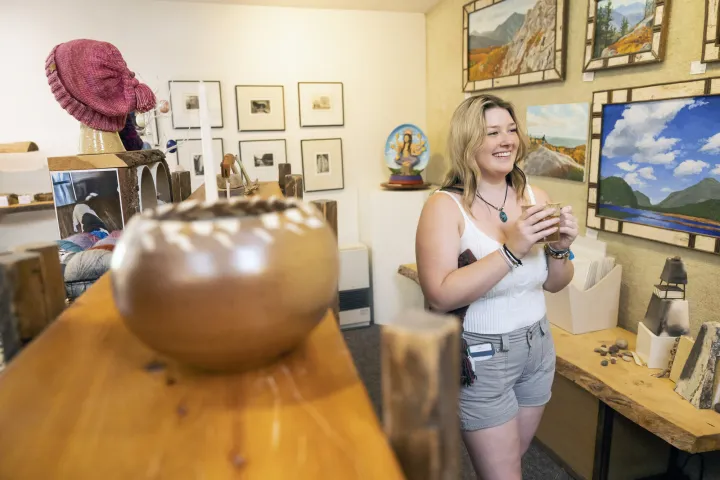 A woman shopping at a gallery and studio
