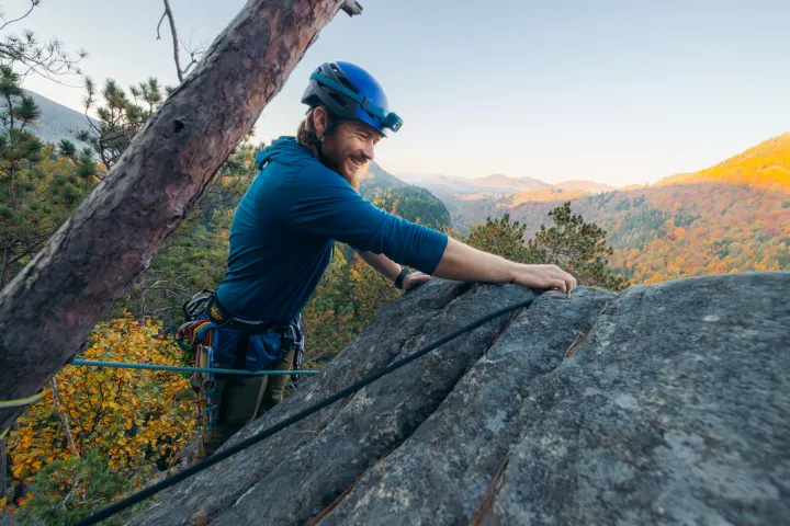A climber setting up a top rope
