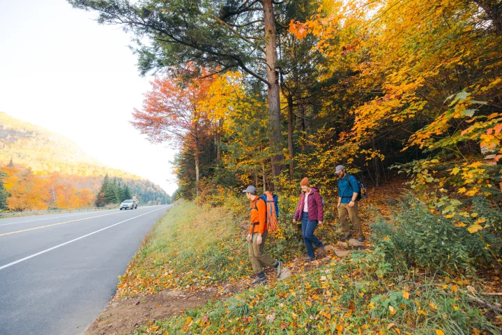 Three climbers walking back from the crag