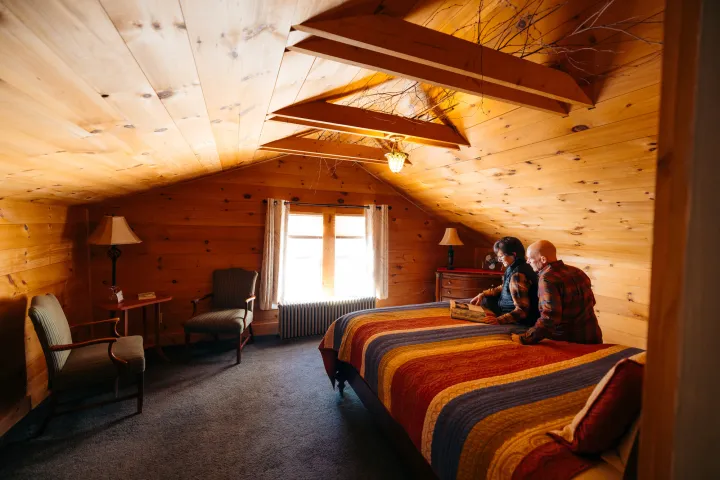 Two people staying in a small cabin