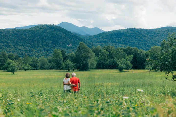 An older couple in a meadow