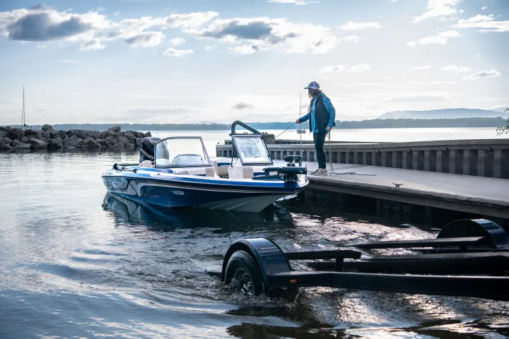 A boat being taken out of the water at a dock