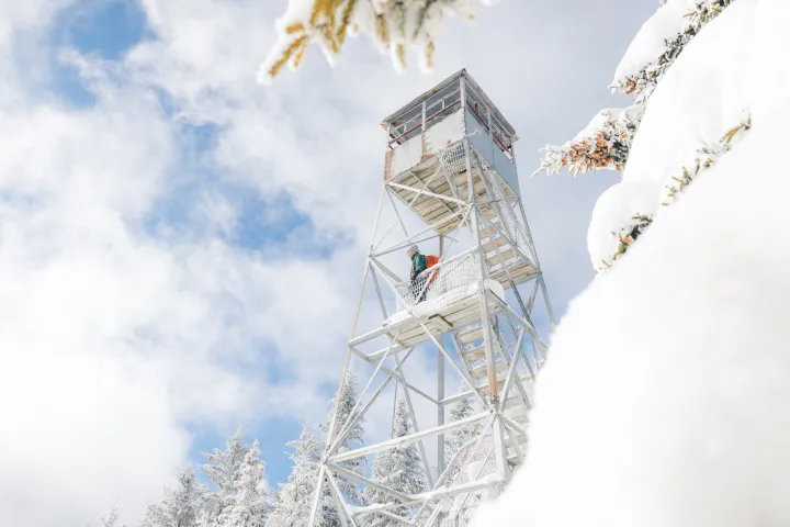 A winter hiker in a fire tower