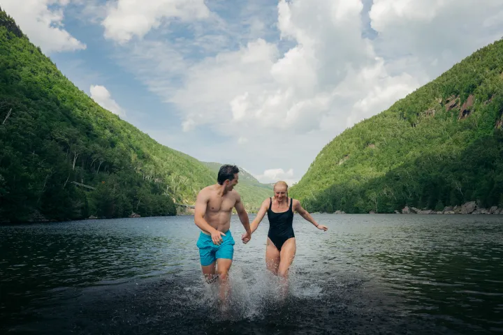 A couple swimming in Cascade Lakes.