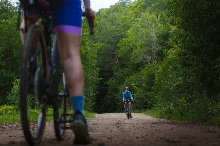 Biking on a gravel road.