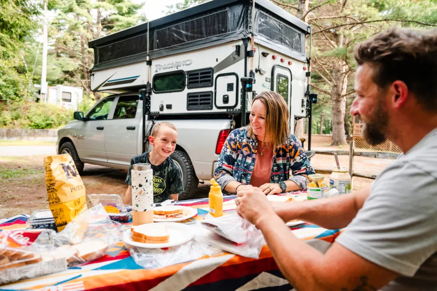A family at a campground in the Adirondack Hub