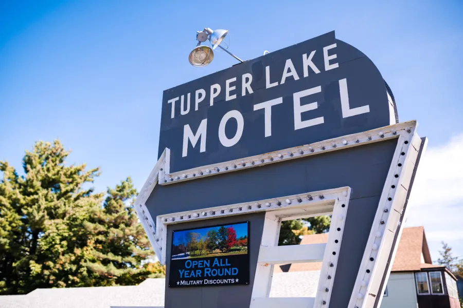 A sign for the Tupper Lake Motel