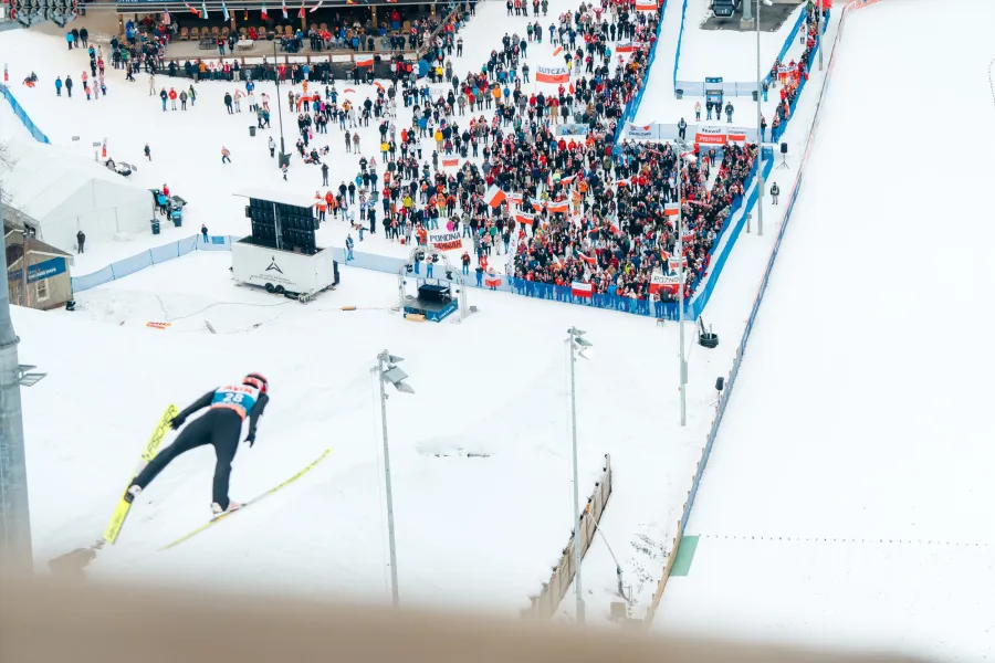 A ski jumper soaring down the hill