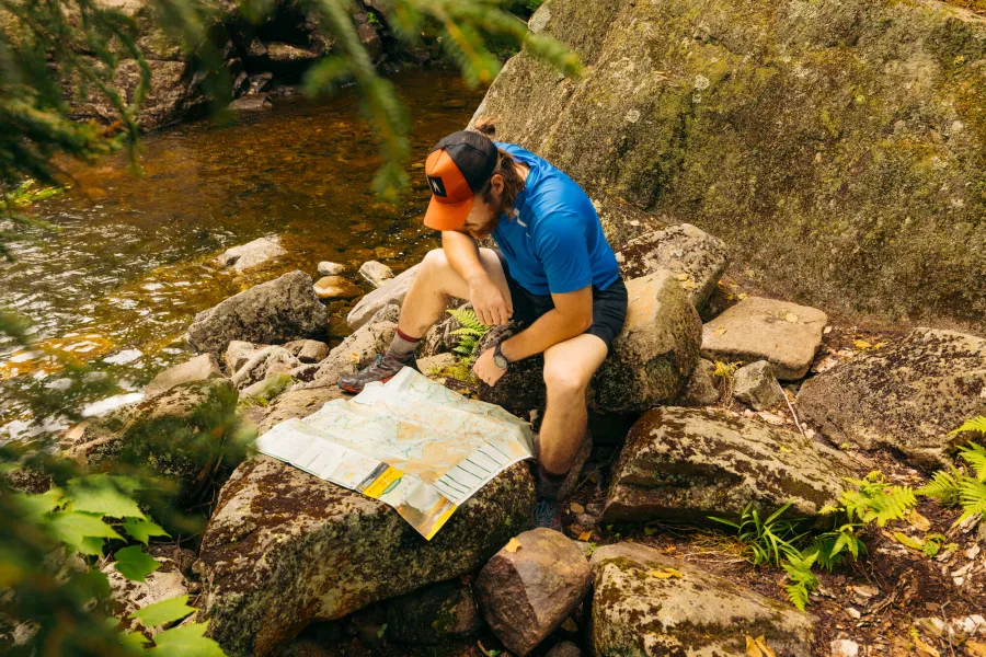 A backpacker looking at a map